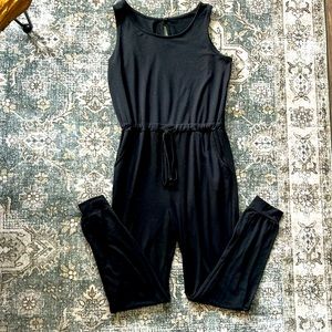 Black romper with cinched waistband and pockets. Barely worn!